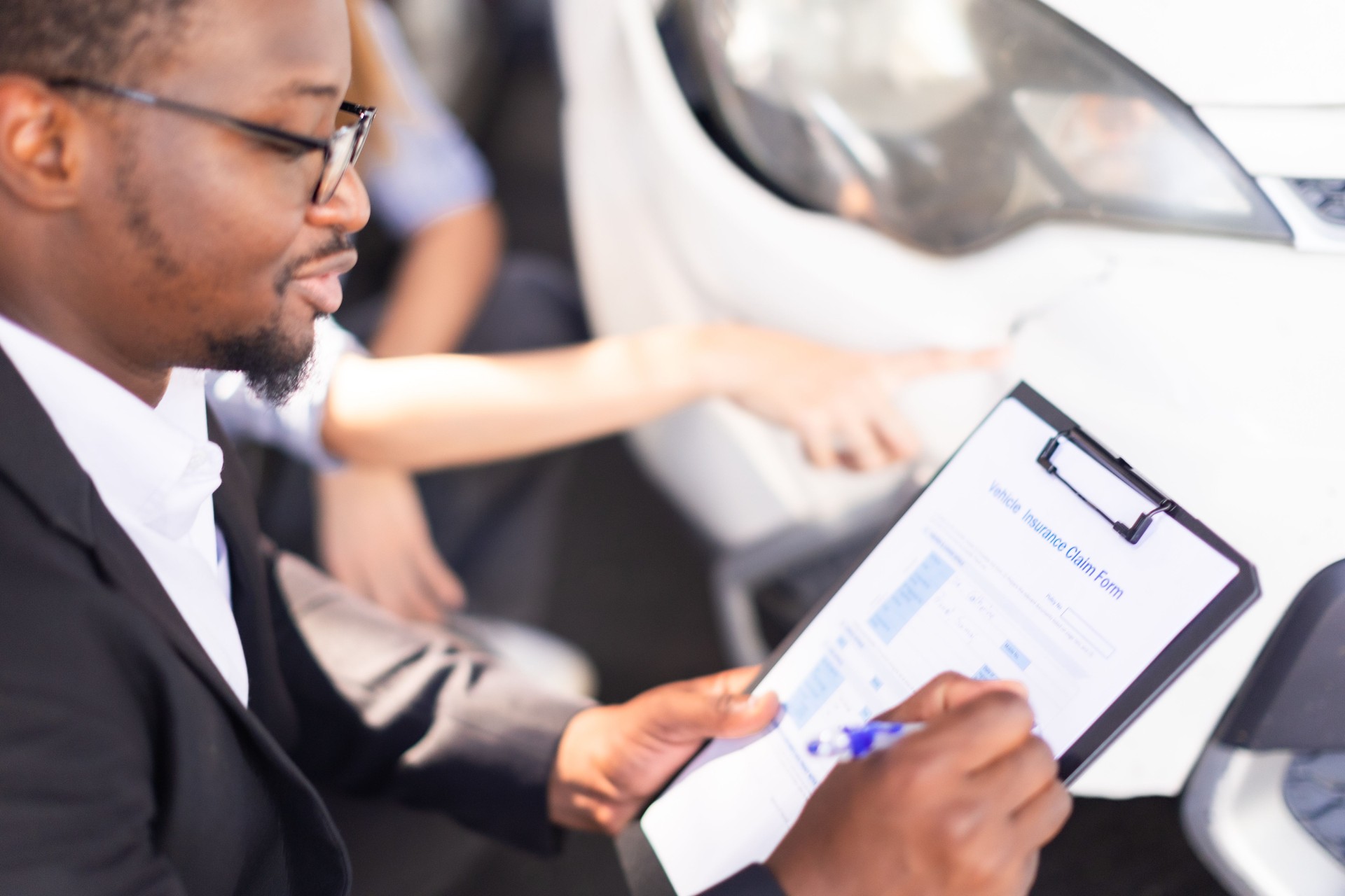 Car Insurance Claims Insurance Claims Assessment Officers examine and consider car accident assessments.Insurance Agent sign contract with Woman having problems with her car Claims adjusterat car damage.